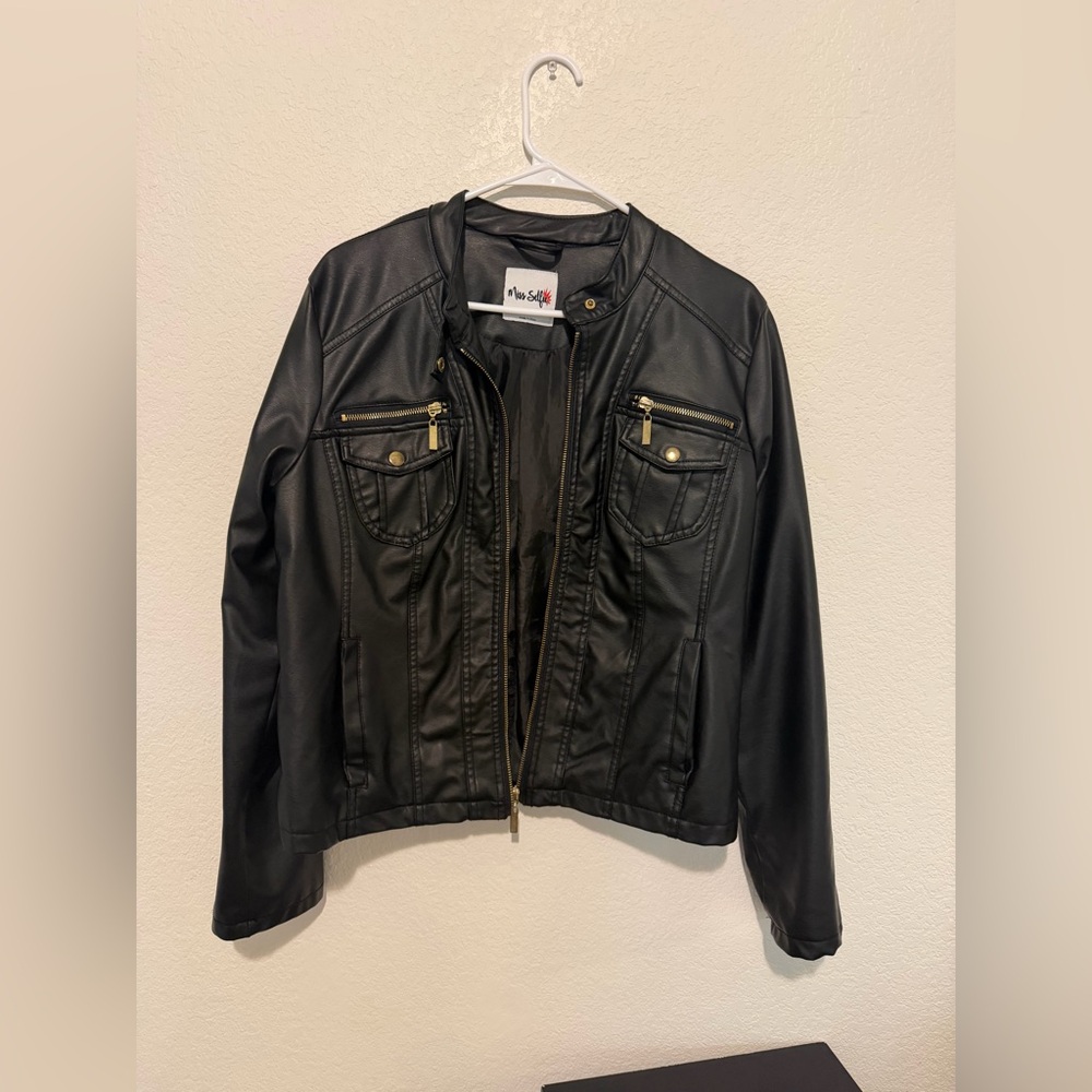 Chic Black Leather Jacket with Gold Accents